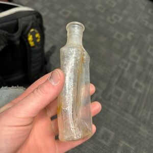 Vintage Wens warped medicine bottle from dump site dig.